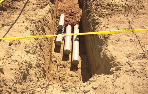 can electrical boxes be laying on ground|underground conduit laying on concrete.